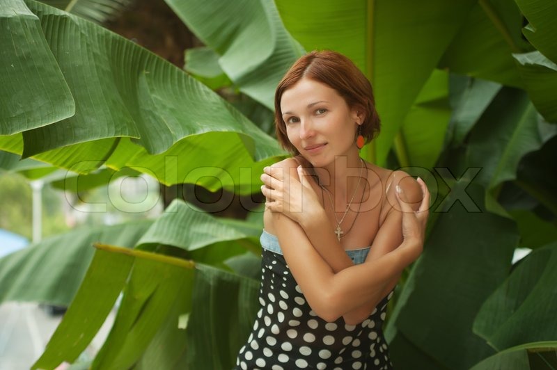 6229546-beautiful-woman-on-leaves-of-palm-background.jpg.jpeg